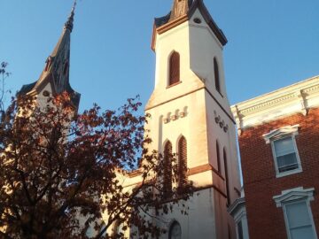 Worm's eye view of the twin steeples on the Evangelical Lutheran Church in the downtown area of Frederick, MD.