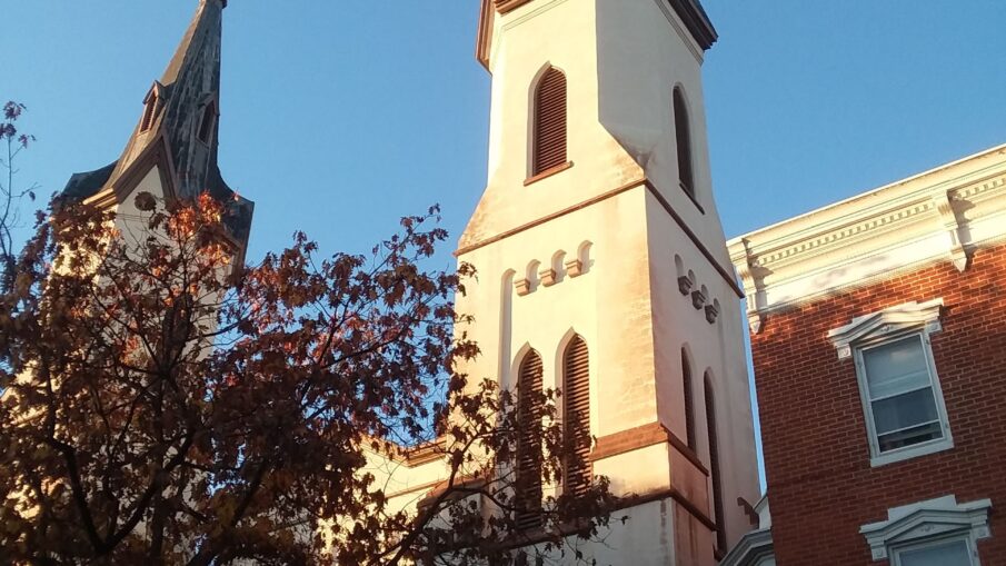 Worm's eye view of the twin steeples on the Evangelical Lutheran Church in the downtown area of Frederick, MD.