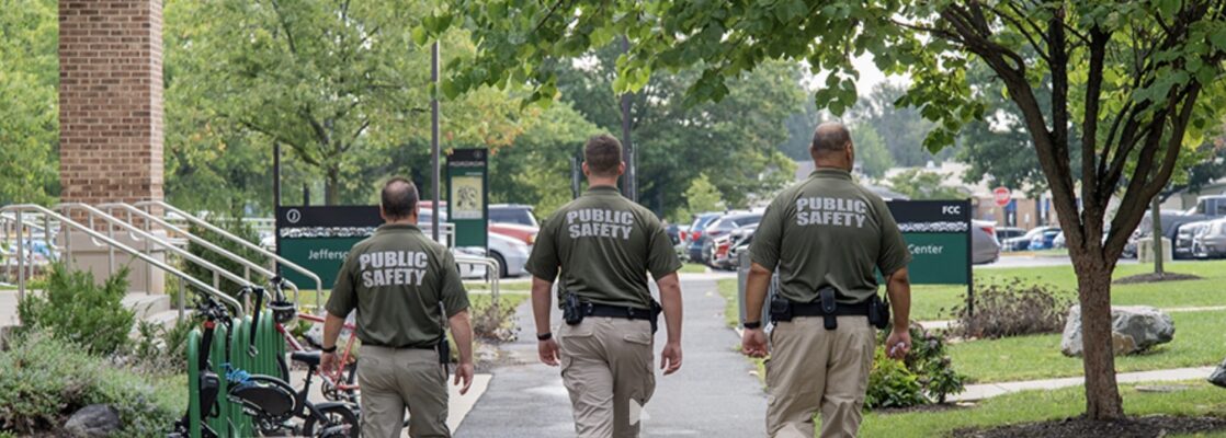 3 campus officers walking across campus